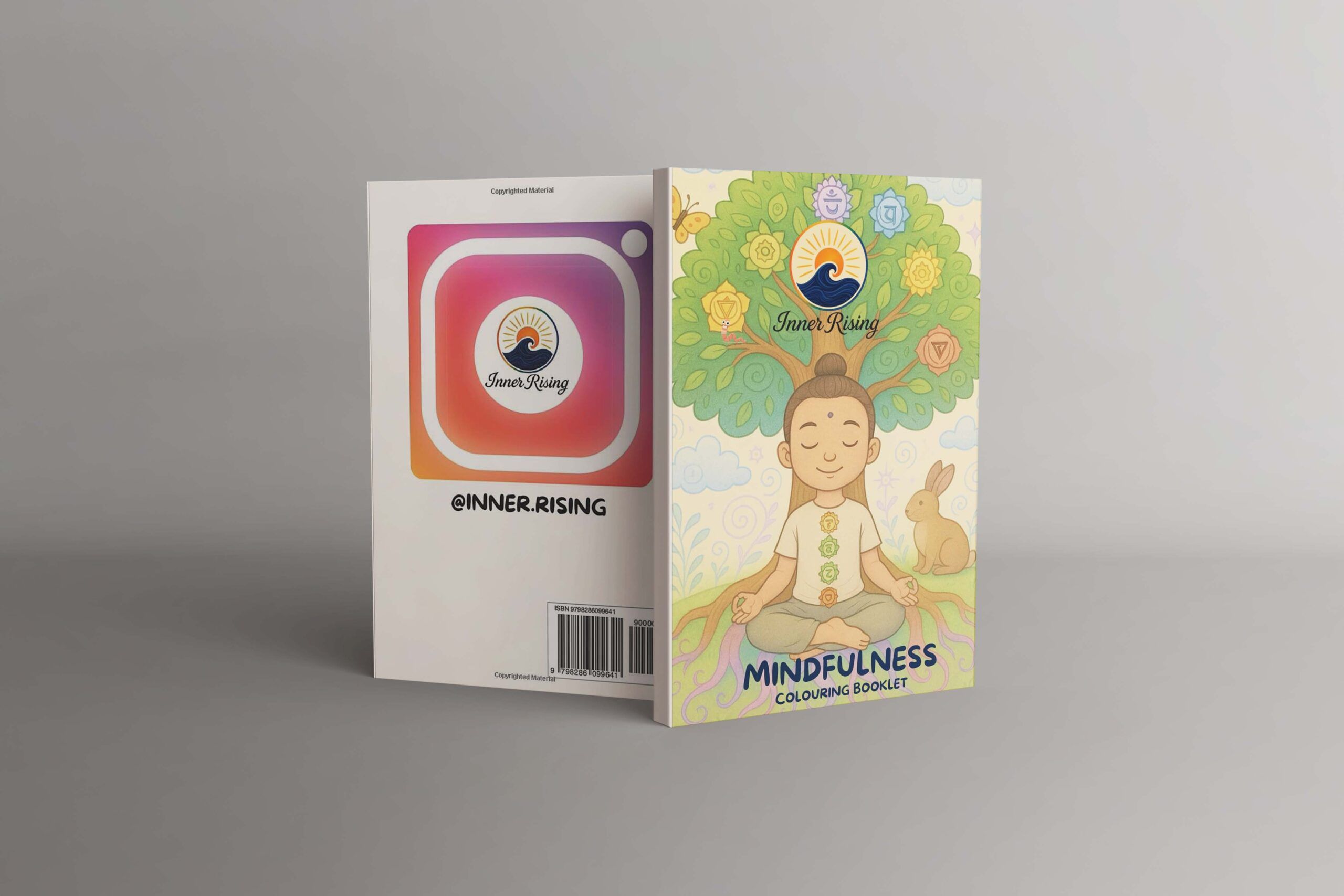 The Breathe and Color mindfulness colouring book open beside coloured pencils
